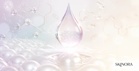 Luminous skincare serum droplet with a molecular-inspired background
